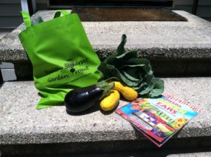 pic of vegetables, a tote bag and recipe sheet
